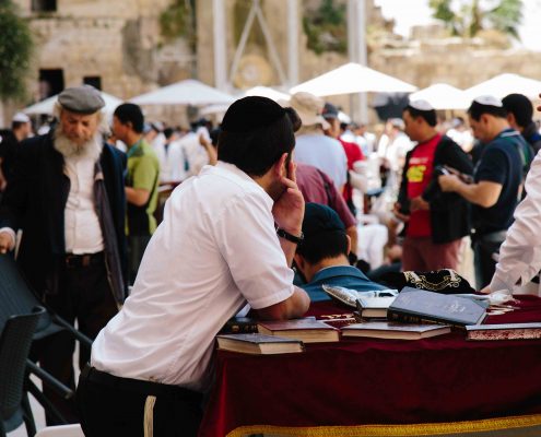 Jewish man observing the scene at the wailing wall